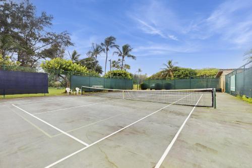 a tennis court with a net on it at Kaha Lani 104 in Lihue