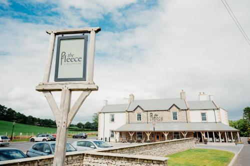 a sign in front of a building at The Fleece at Ruleholme in Carlisle