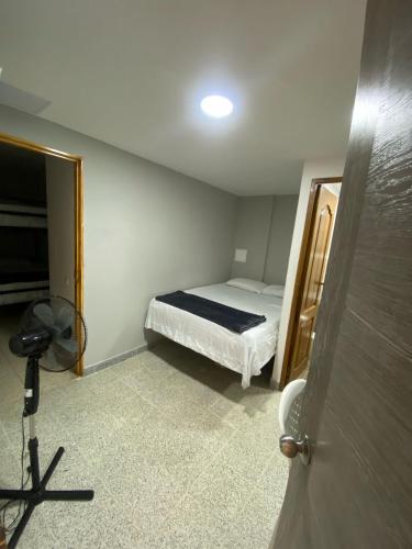 Una cama o camas en una habitación de Hotel Don Pacho