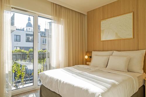 Postel nebo postele na pokoji v ubytování Marone Suites Budapest