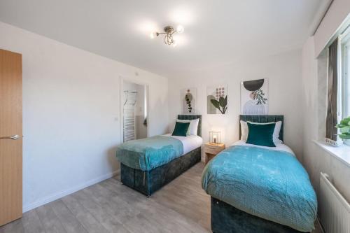 Ένα ή περισσότερα κρεβάτια σε δωμάτιο στο Cambridge 5 Bedrooms Sleeps 10 Free Parking 4 Bathrooms