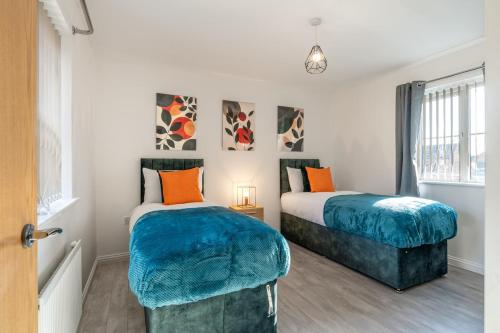 Ένα ή περισσότερα κρεβάτια σε δωμάτιο στο Cambridge 5 Bedrooms Sleeps 10 Free Parking 4 Bathrooms