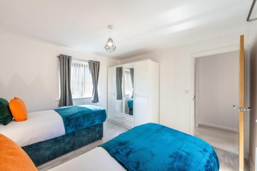 Ένα ή περισσότερα κρεβάτια σε δωμάτιο στο Cambridge 5 Bedrooms Sleeps 10 Free Parking 4 Bathrooms