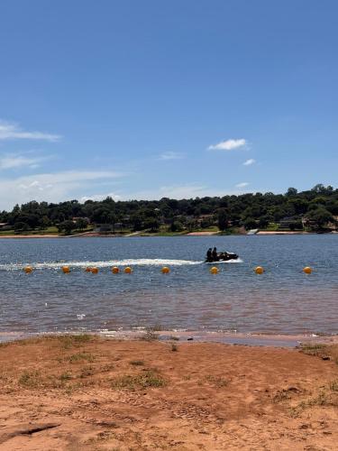 a person on an object in the water at Riviera Santa Cristina l in Arandu