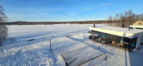 an aerial view of a house in the snow at Riverside villa with sauna and jacuzzi in Rovaniemi
