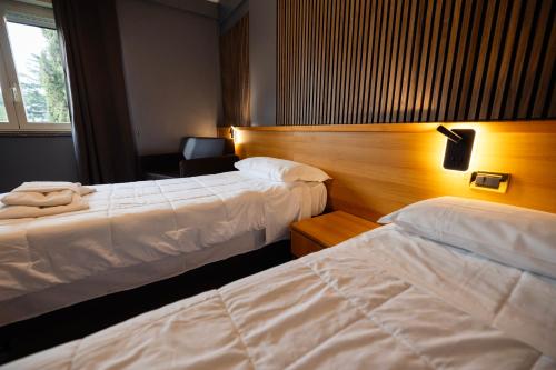 Letto o letti in una camera di Scheppers Hotel