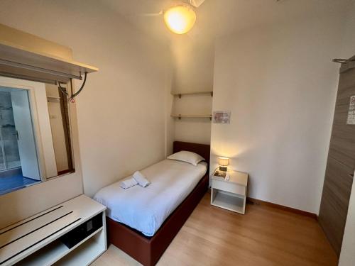 Postel nebo postele na pokoji v ubytování Hotel Locanda Castagnola