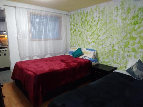 Ένα ή περισσότερα κρεβάτια σε δωμάτιο στο Apartaestudio 90