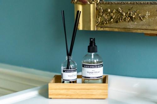 two bottles of essential oils sitting on a table at Landgoed Loenen B&B in Slijk-Ewijk