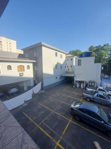 a parking lot with a car parked in it at Hotel Mooca in Sao Paulo