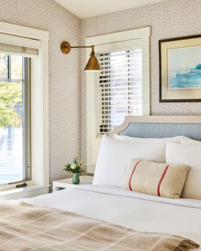 a bedroom with a white bed and a window at The White Barn Inn & Spa, Auberge Collection in Kennebunk