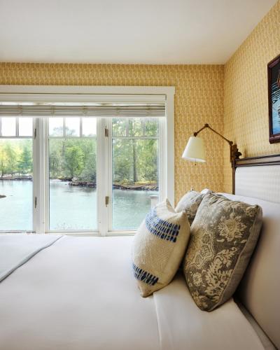 a bedroom with a bed with two pillows on it at The White Barn Inn & Spa, Auberge Collection in Kennebunk
