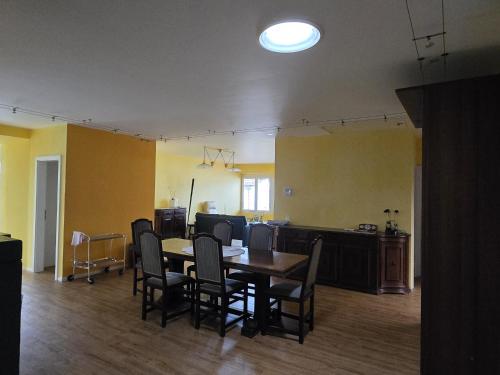 an empty room with a dining table and chairs at Il Baitone 1 in Minusio