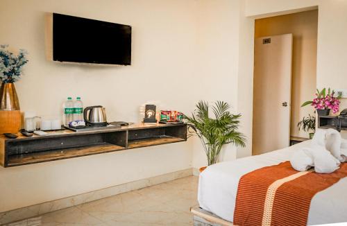 Ένα ή περισσότερα κρεβάτια σε δωμάτιο στο Ostro Inn New Town