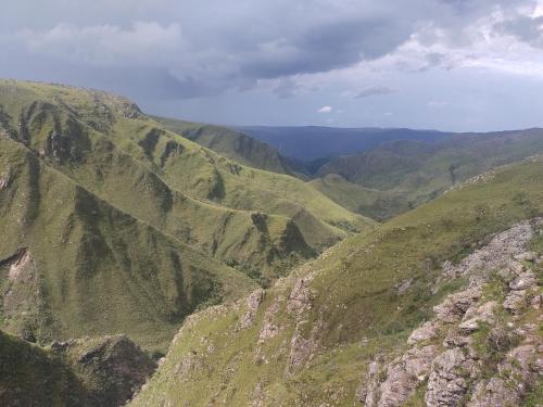 an aerial view of a mountain valley with hills at Sons da Canastra Pousada e Terapias - em São José do Barreiro - São Roque de Minas MG in São Roque de Minas