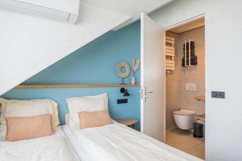 Ένα ή περισσότερα κρεβάτια σε δωμάτιο στο Huis 8 Studio's