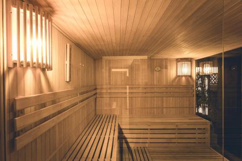 a sauna with wood paneling and a wooden ceiling at wellness Chata u Pinkasů in Písečná