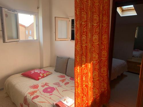 Ένα ή περισσότερα κρεβάτια σε δωμάτιο στο Ma jolie petite maison de la plage