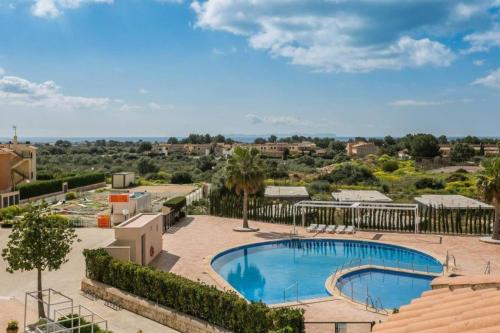 an image of a swimming pool at a resort at Residence Club el Paraiso 37 in Sa Ràpita