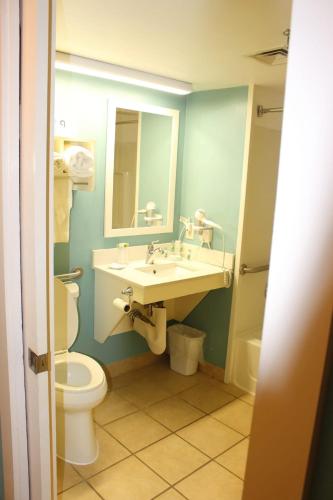 a bathroom with a sink and a toilet at Barclay Towers Resort in Virginia Beach