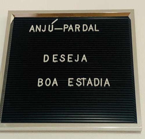 a sign for a parlor in a building at Anjú-Pardal in Mogadouro
