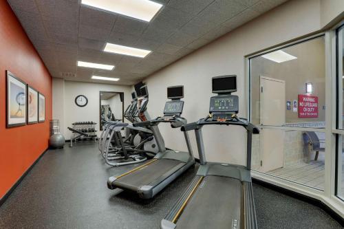 a gym with treadmills and ellipticals in a room at Drury Inn & Suites Charlotte Northlake in Charlotte