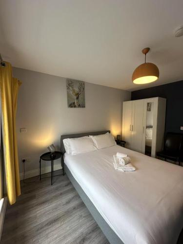 a bedroom with a large white bed in it at Abbey Apartments in Dublin