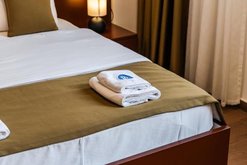 Ein Bett oder Betten in einem Zimmer der Unterkunft Apart Hotel Perla Resort Lalez Durres