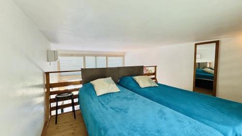 En eller flere senge i et værelse på Appartement Libeccio 22 LUMIO