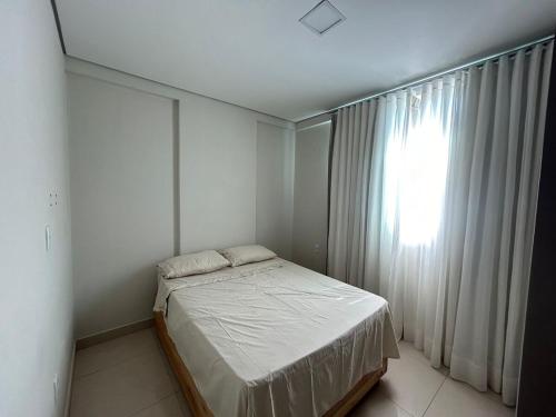 Ένα ή περισσότερα κρεβάτια σε δωμάτιο στο Apartamento 402
