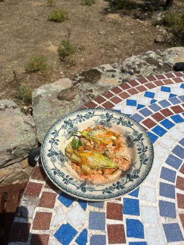 a plate of food sitting on a table at L'Aghjalle in Santa-Reparata-di-Balagna