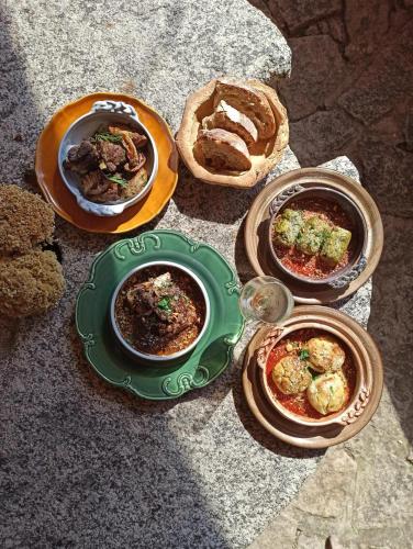 a group of plates of food on a table at L'Aghjalle in Santa-Reparata-di-Balagna