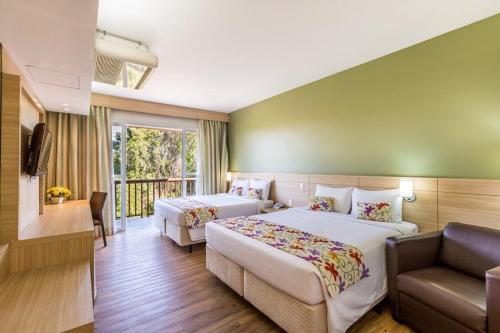 Ένα ή περισσότερα κρεβάτια σε δωμάτιο στο Tauá Hotel & Convention Caeté