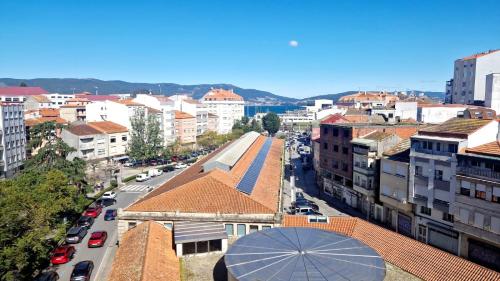 a view of a city with buildings and a street at Piso Mariña in Marín