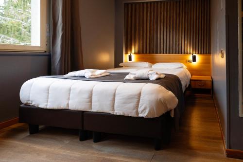 Letto o letti in una camera di Scheppers Hotel