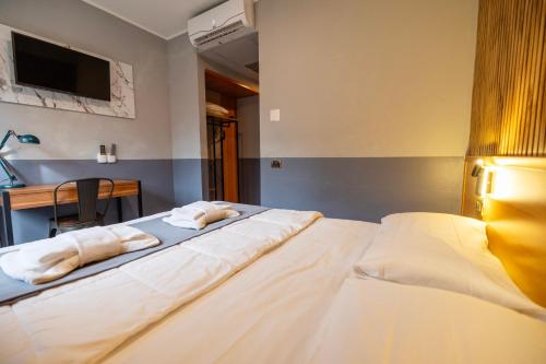 Letto o letti in una camera di Scheppers Hotel