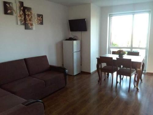 a living room with a couch and a table at Agroturystyka nad Wigrami pokoje u Kasi i Tomka in Cimochowizna