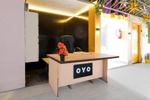 an office desk with a yes sign on it at Hotel O Jannat in Chupra