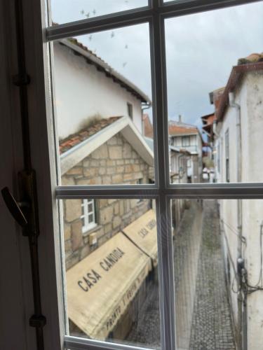 a window with a view of a street outside at Residencial Bem Estar in Chaves
