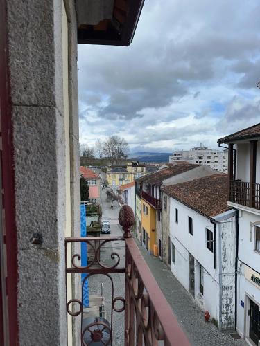 a view of a street from a balcony of a building at Alojamento Central in Chaves