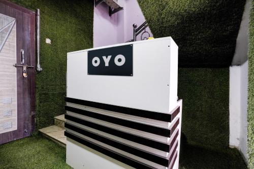 a white box with an ovo sign on it at Hotel O Moonlight Residency in Mumbai