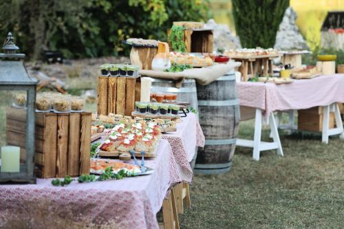 a table filled with desserts and food on tables at Whaka Lodge in Seissan