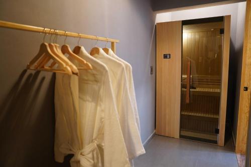 a row of white clothes hanging on a rack in a room at Pure in Mexico City