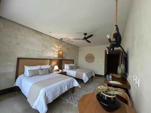 Postel nebo postele na pokoji v ubytování Hotel Mundo Maya Nuevo Uxmal