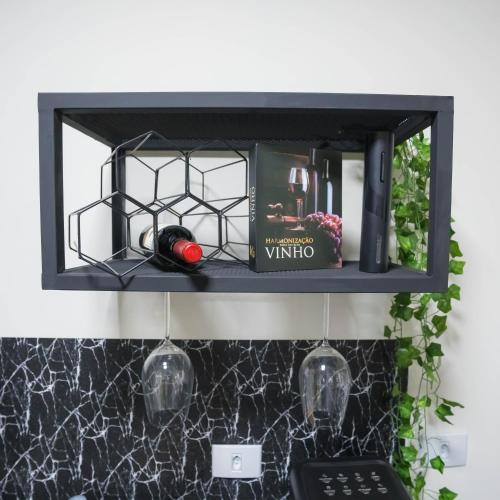 a black shelf above a kitchen counter with wine glasses at Pousada Sunrise Container in Araçoiaba da Serra