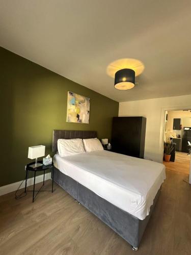 a bedroom with a large white bed in a room at Abbey Apartments in Dublin