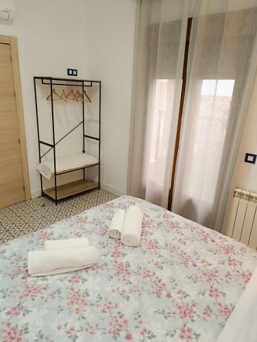 Katil atau katil-katil dalam bilik di Al-Qazeres Suites
