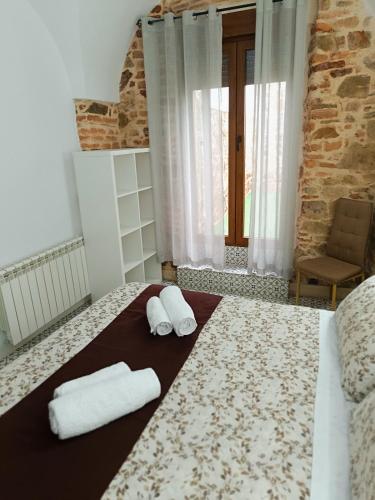 Katil atau katil-katil dalam bilik di Al-Qazeres Suites