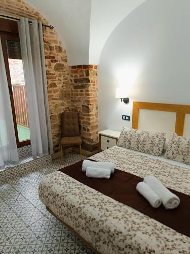 Katil atau katil-katil dalam bilik di Al-Qazeres Suites