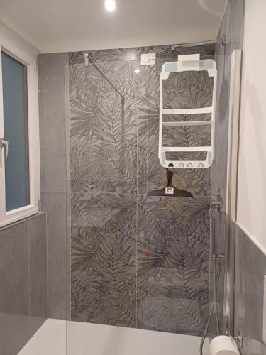a shower in a bathroom with a wall at Matt house in La Spezia